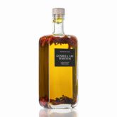  Bottle of extra virgin olive oil infused with chilli, garlic and pepper, on a white background.