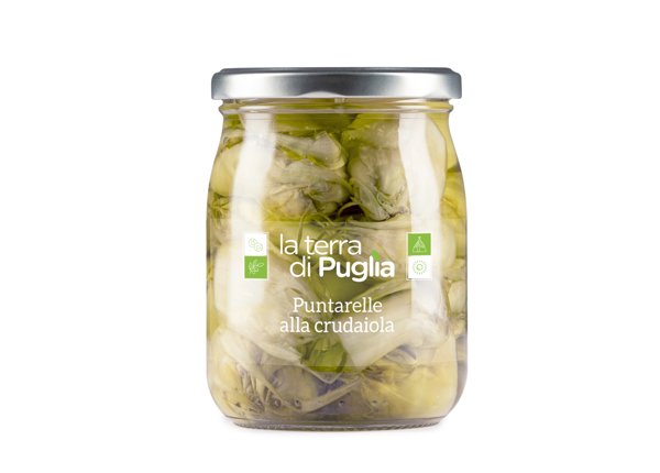 Jar of puntarelle alla crudaiola, vegetables preserved in oil.